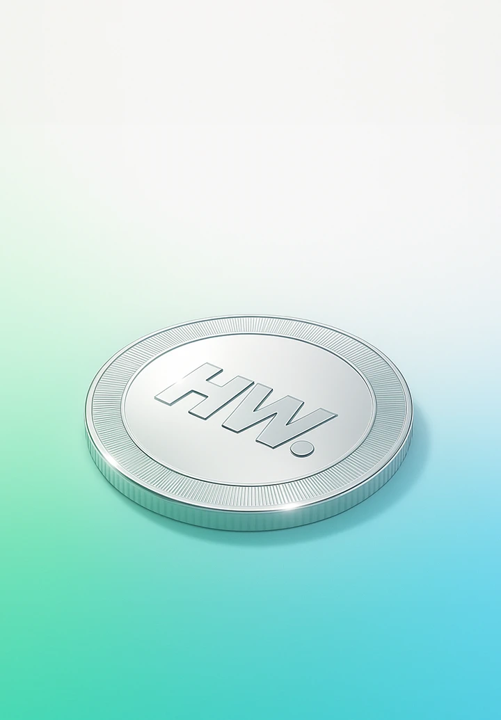 Silver coin with the "HW" logo.