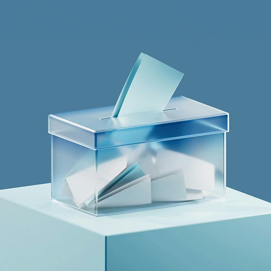 Transparent mailbox with several paper letters inside and one letter being inserted.