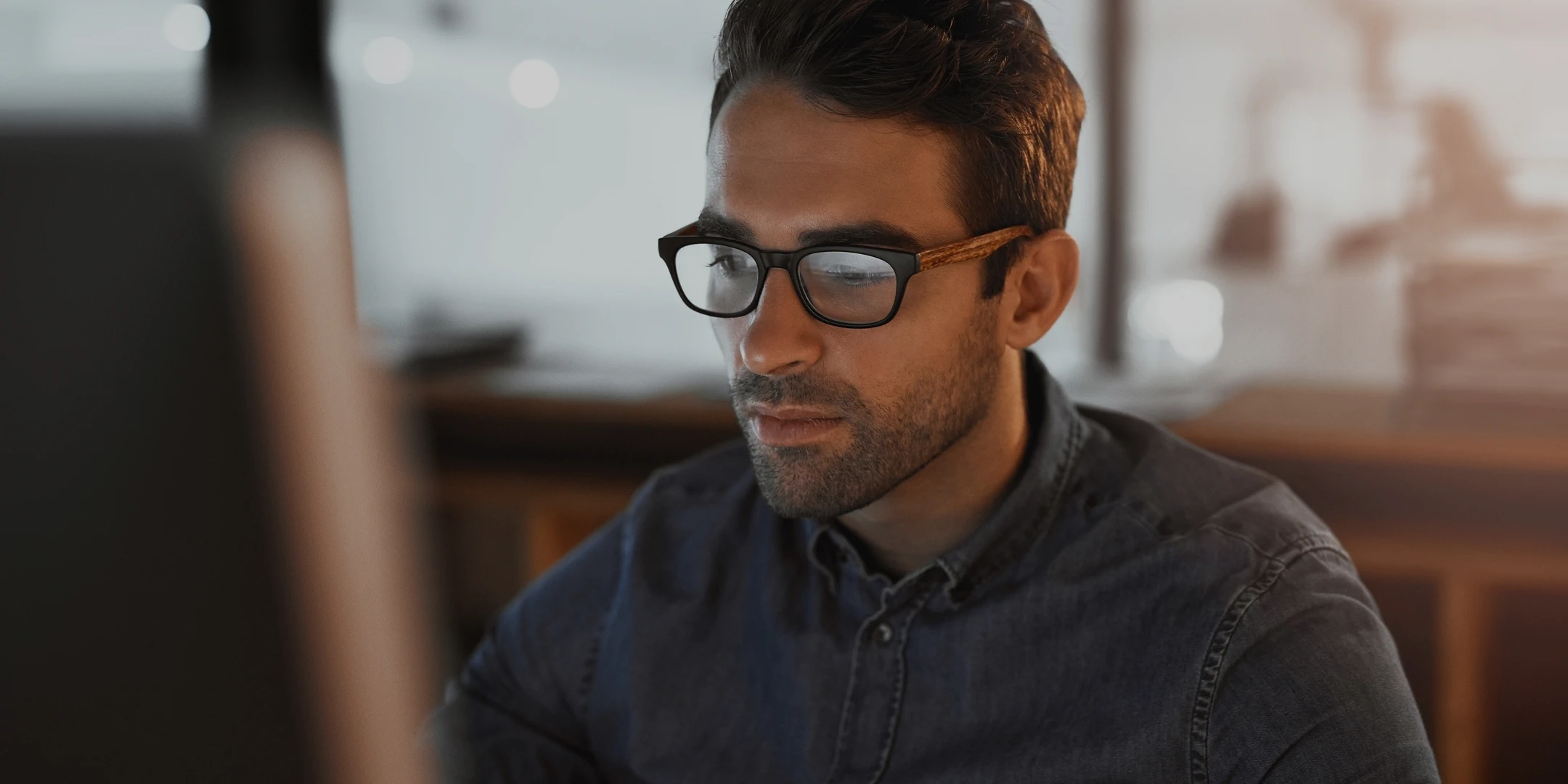 Technical support agent working on a computer.