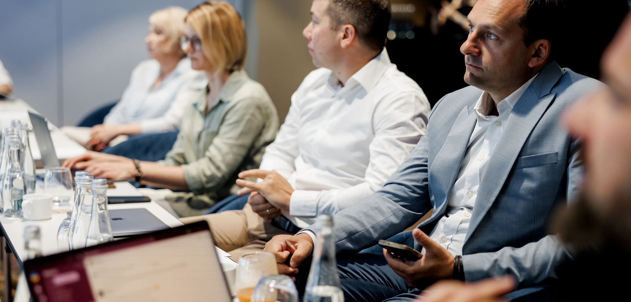 Group of people is sitting in a meeting