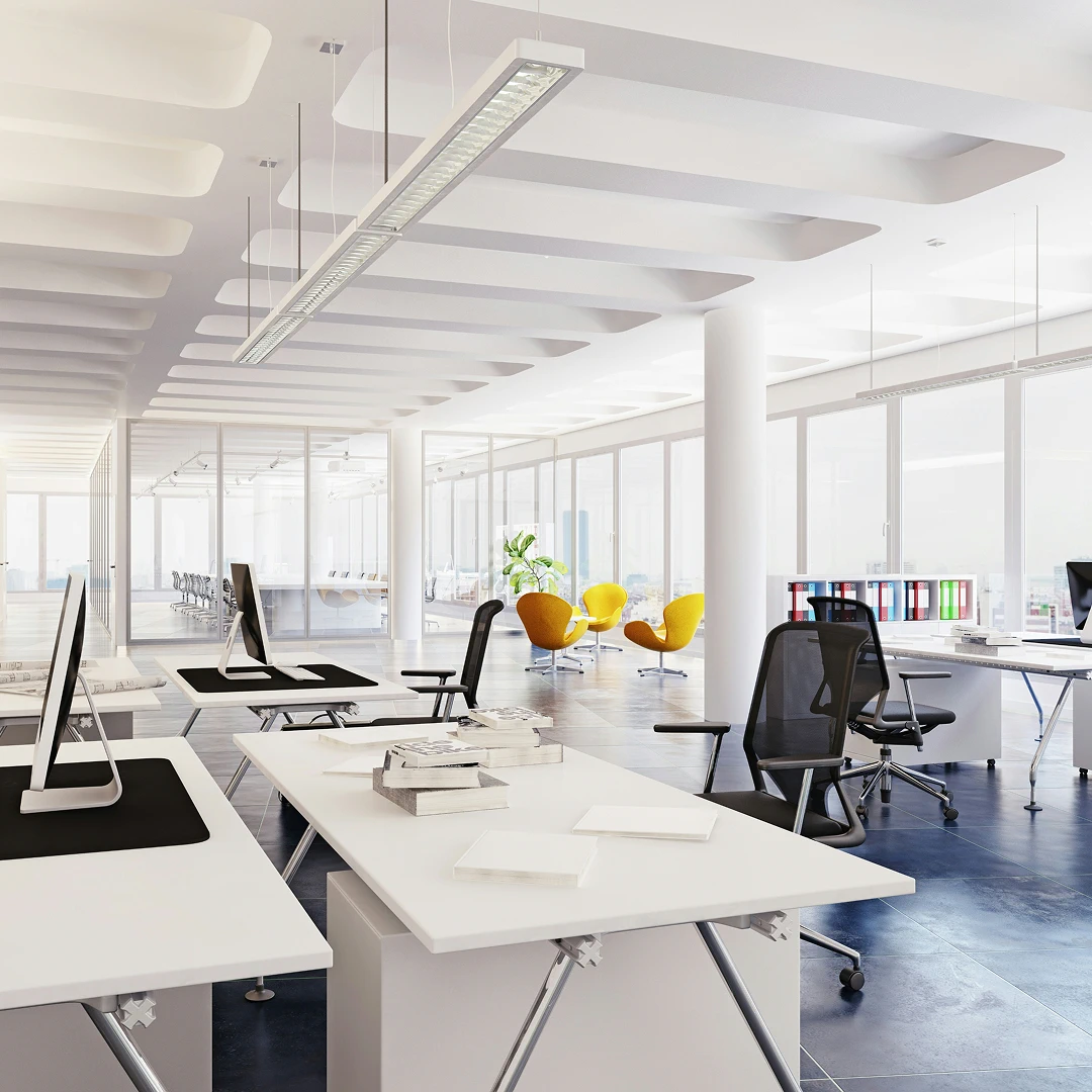 Bright, modern office space with desks, chairs, and large windows