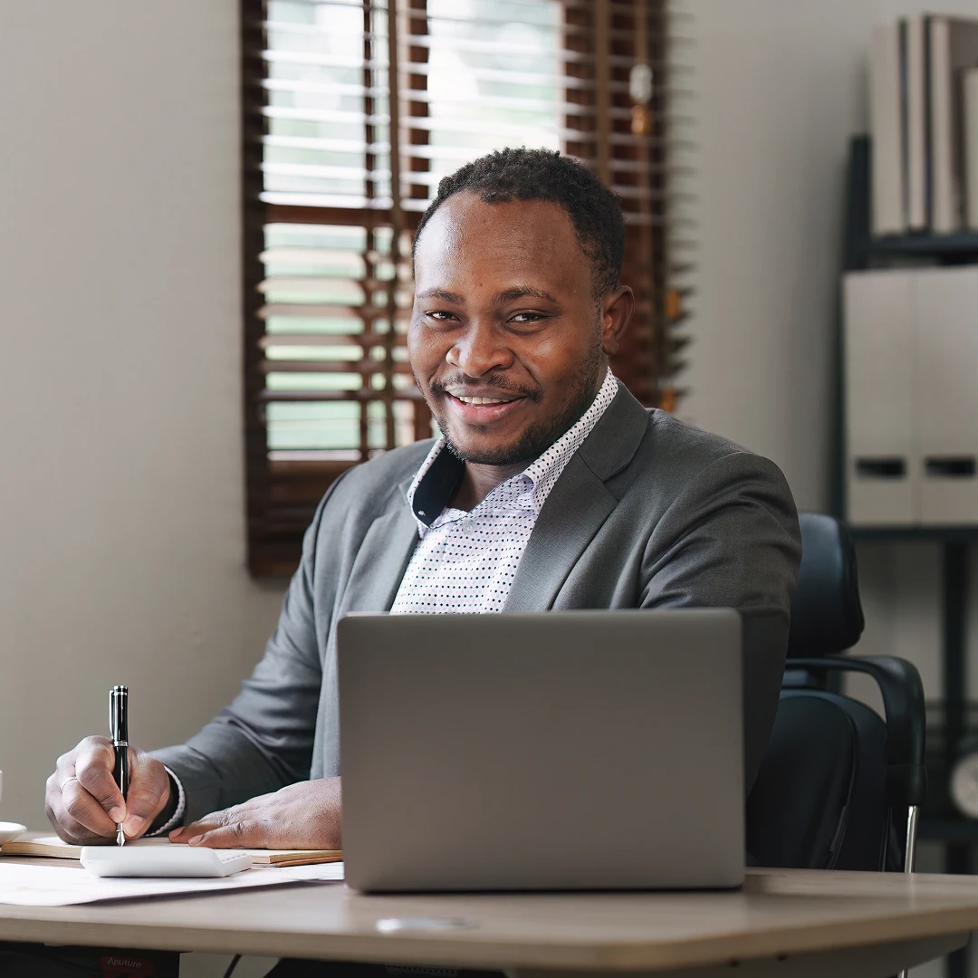 Professional South African call center agent in grey suit assisting customers