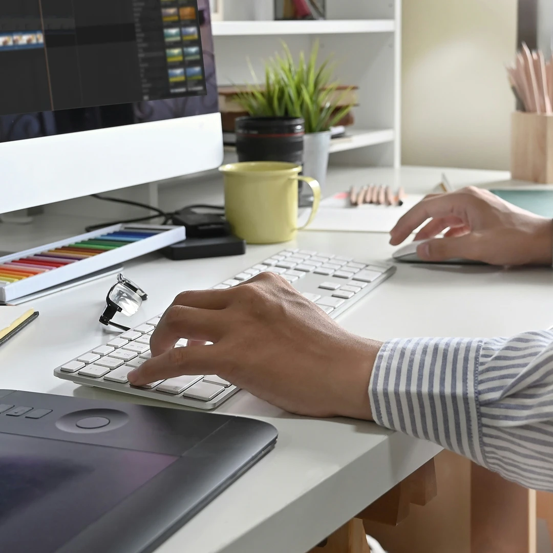 Hands of an ecommerce support representative working on a computer