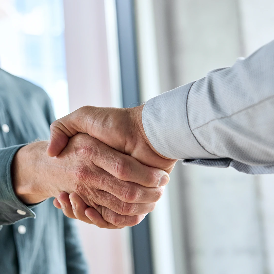 Two people are shaking hands