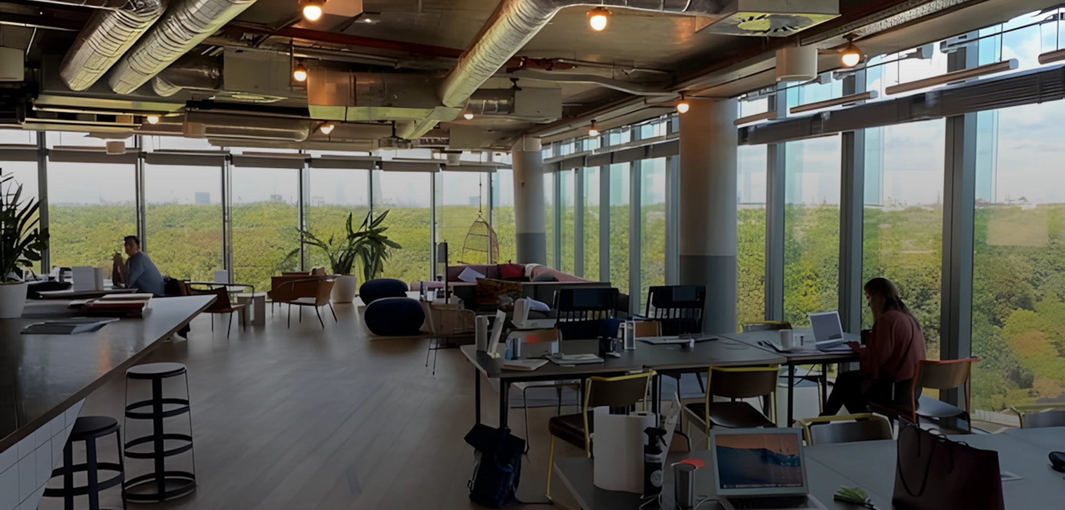Modern office space in Georgia with floor-to-ceiling windows overlooking lush greenery