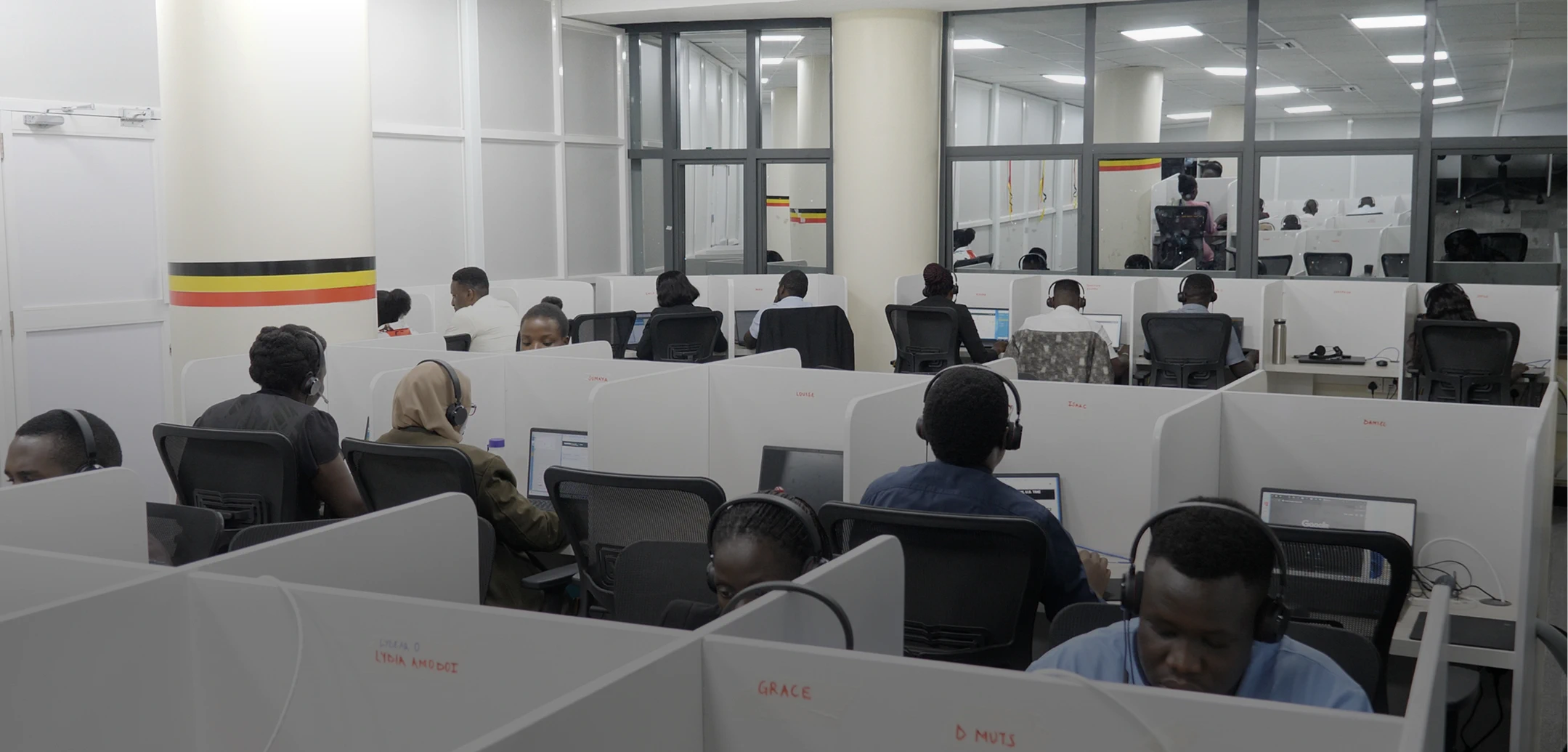 Helpware's Uganda call center team working in a modern office