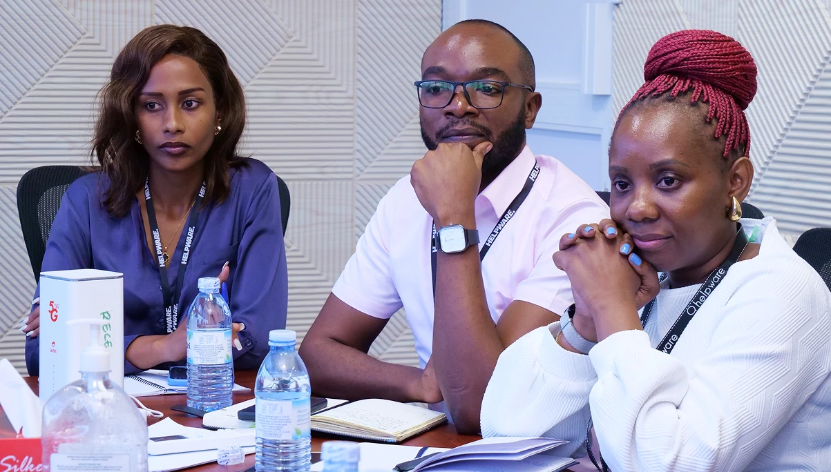 Attentive Helpware employees in meeting