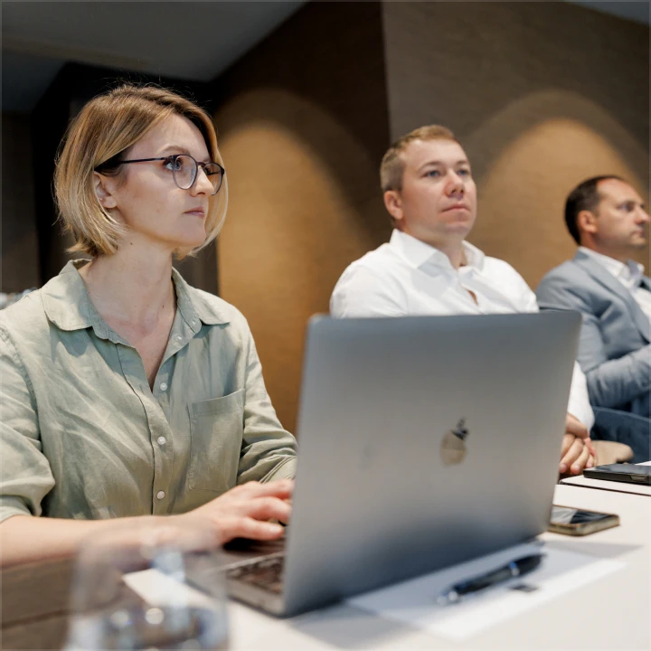 our CEO sitting next to employees