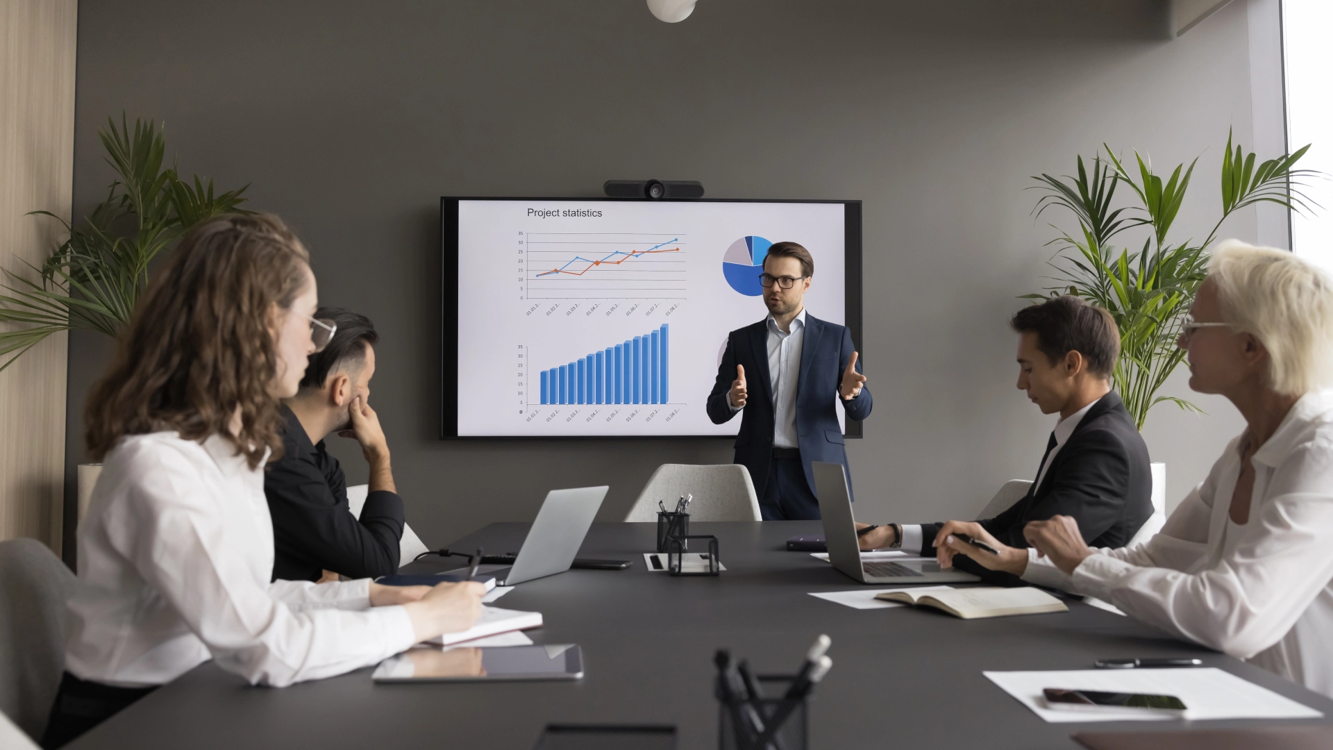 Team reviews data and analytics during a strategy meeting.